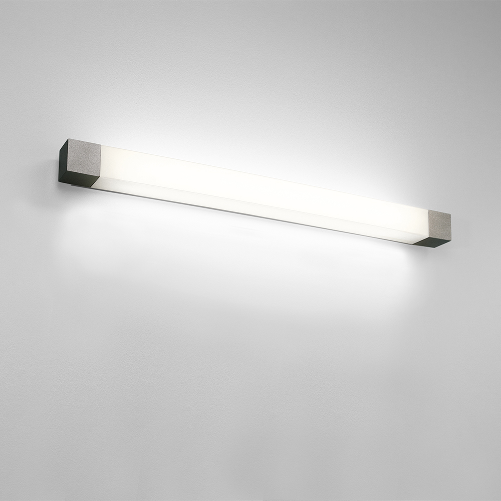 A luminous rectangular wall sconce with solid end caps 