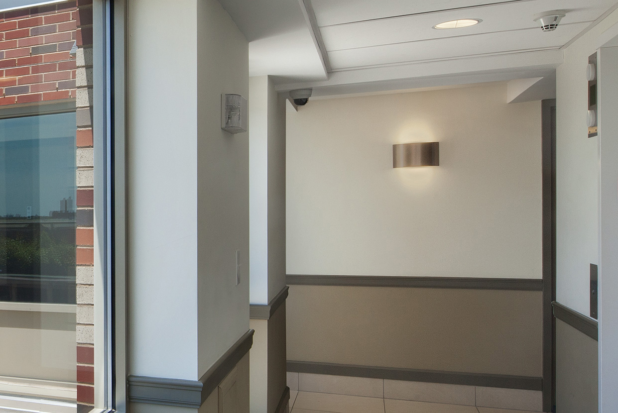 Wrap’s metal housing curves around the light source, providing up and down light. Having top and bottom lenses, Wrap is an ideal choice for healthcare and commercial spaces.