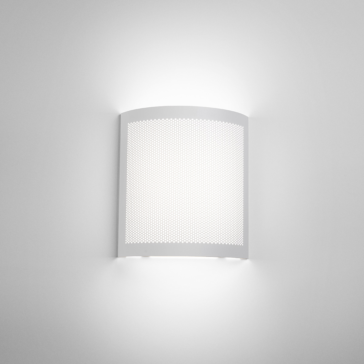 A square indirect wall sconce with a curved, perforated front plate