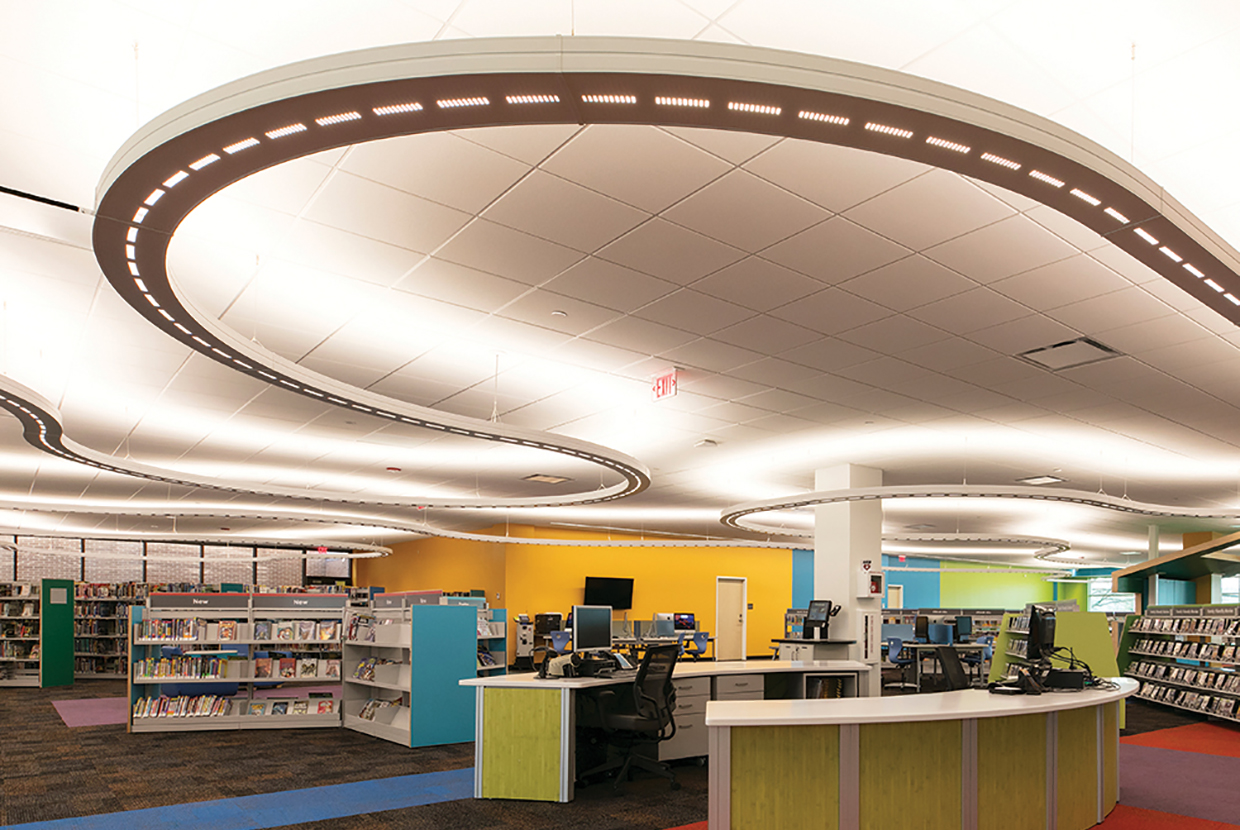Infinity Performance configurable pendant in education lighting design above modern children's library. 