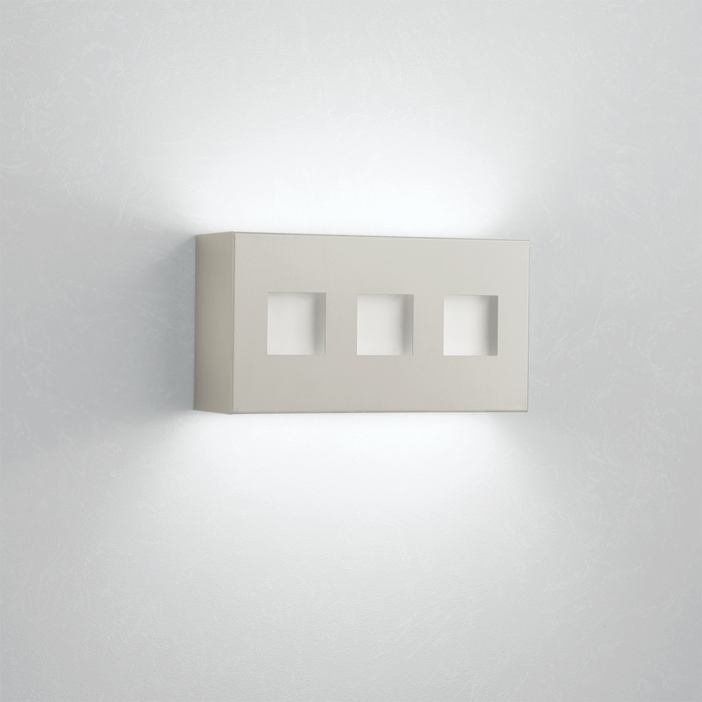 A box-like linear wall sonce with uplight and downlight