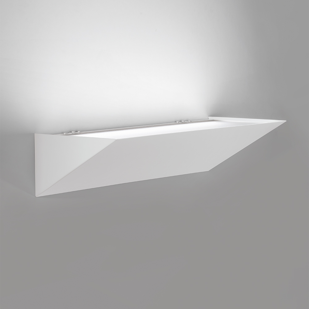 A sharp, angled indirect wall sconce with a solid body