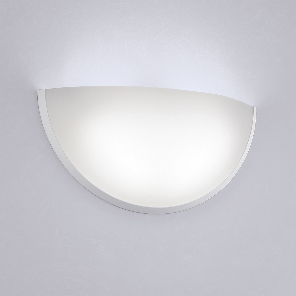 A clean, luminous quarter sphere wall sconce with minimal trim