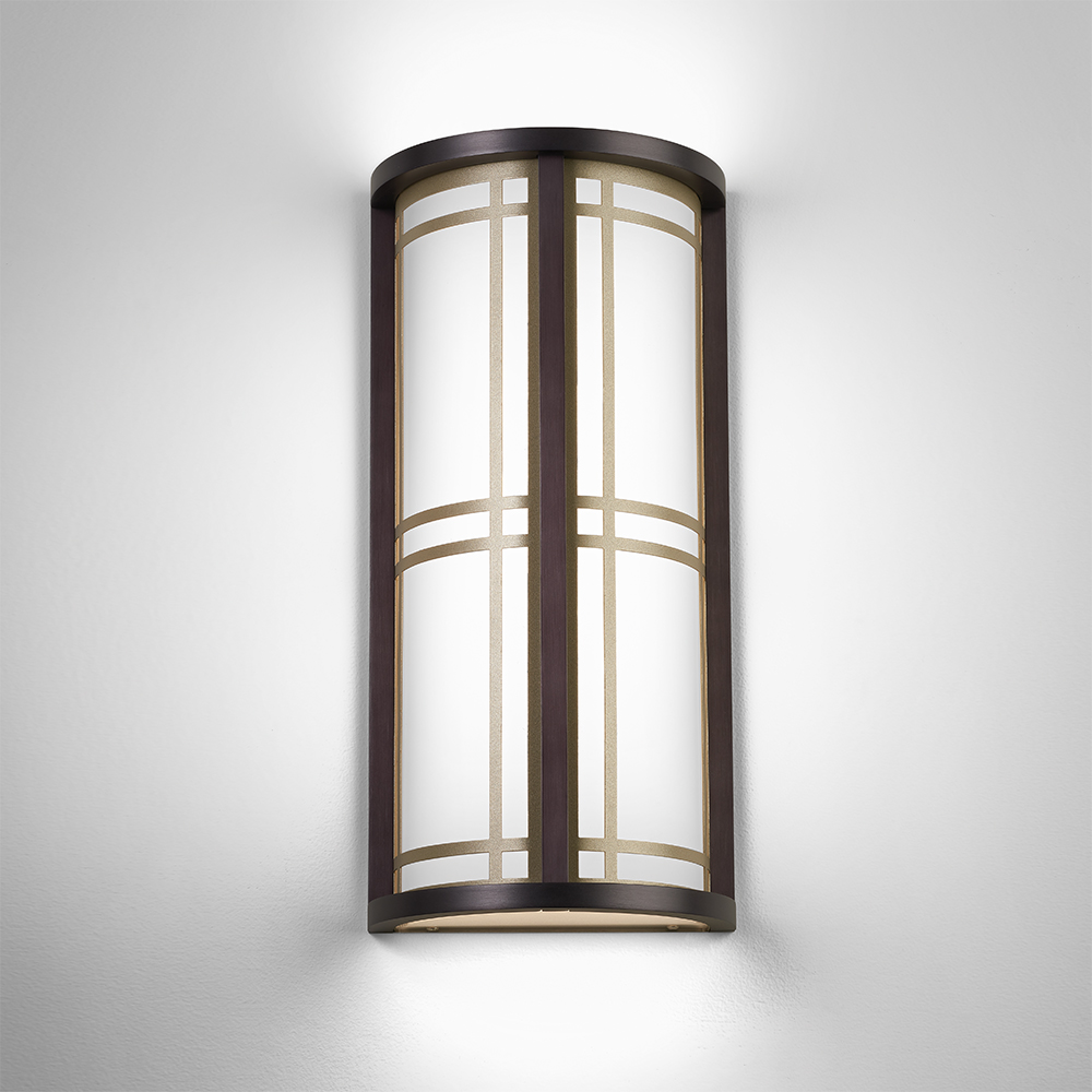 A classic architectural wall sconce with frame accents 