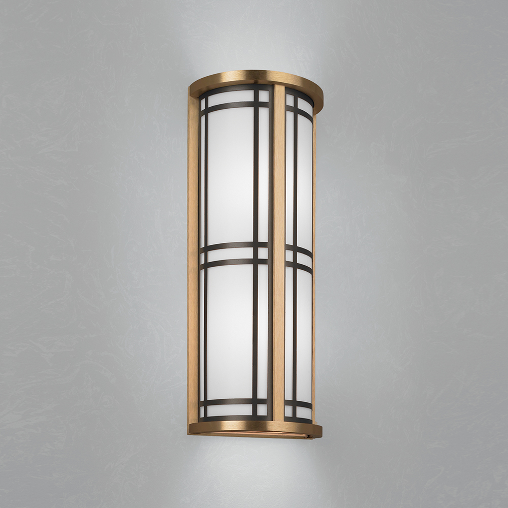 A classic architectural wall sconce with frame accents 