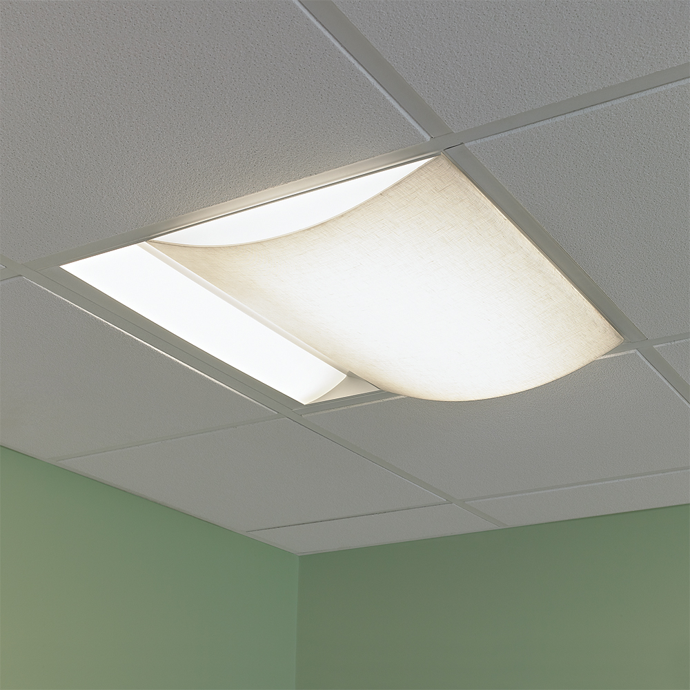 A 2x2 ceiling fixture with a curved fabric-like lens