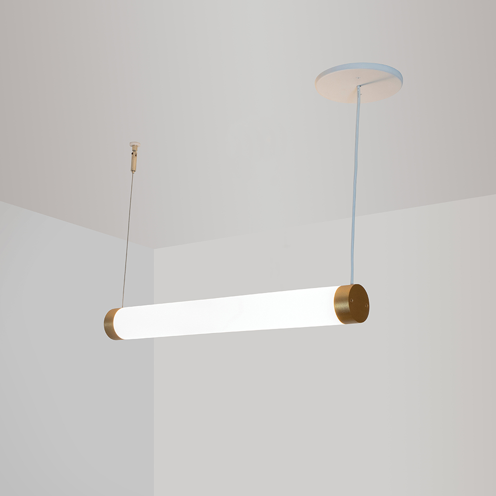 A thin, long, luminous cylinder pendant hung horizontally with cables