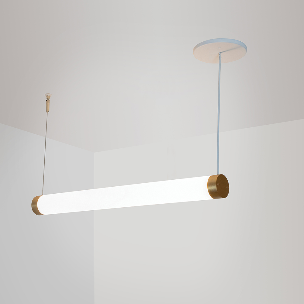 A thin, long, luminous cylinder pendant hung horizontally with cables