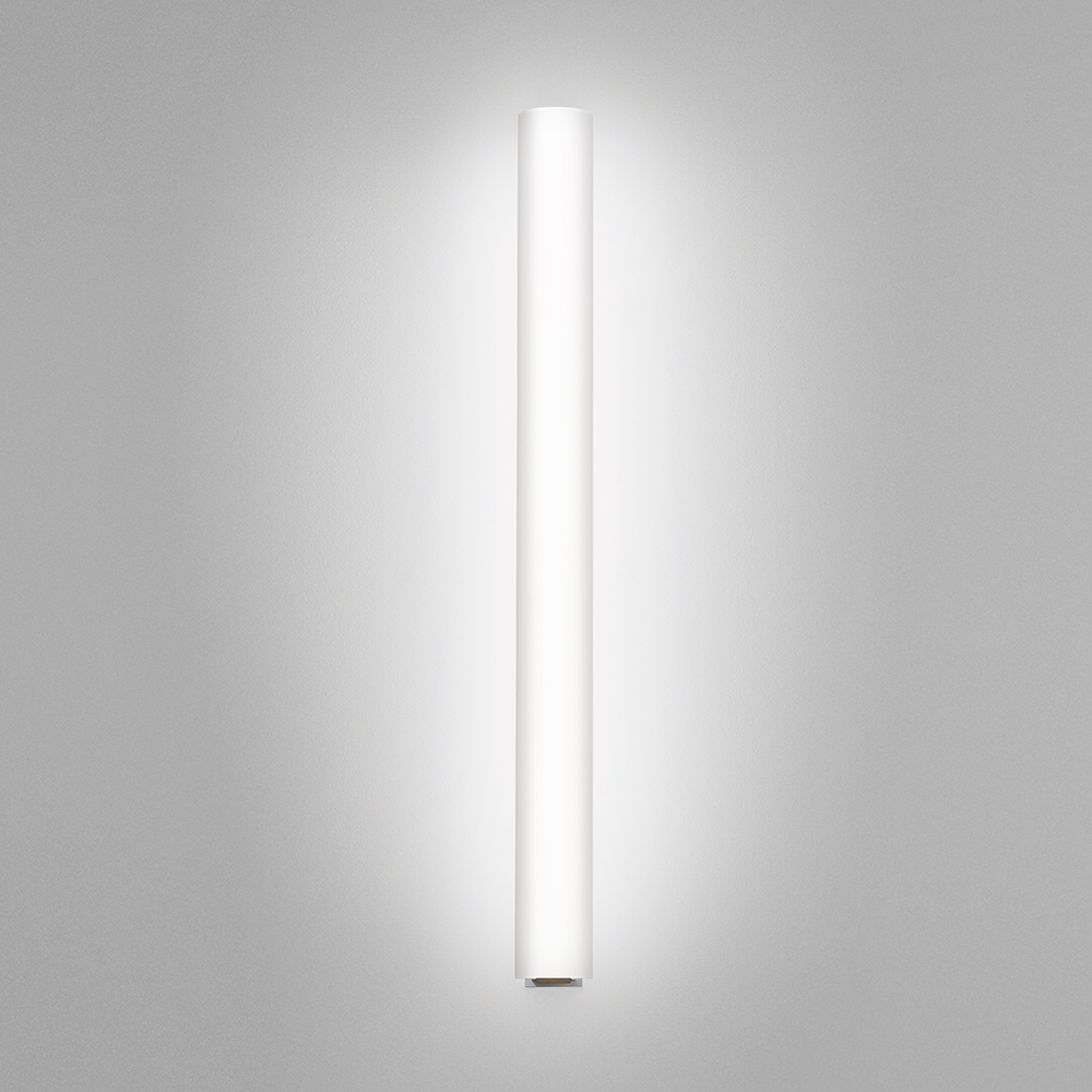 A thin linear surface-mounted luminaire with a fully luminous round body