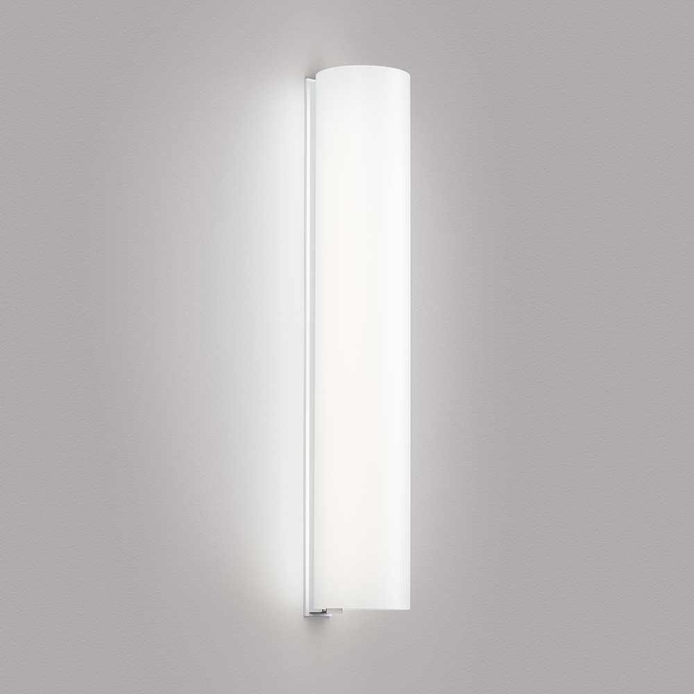 A thin linear surface-mounted luminaire with a fully luminous round body