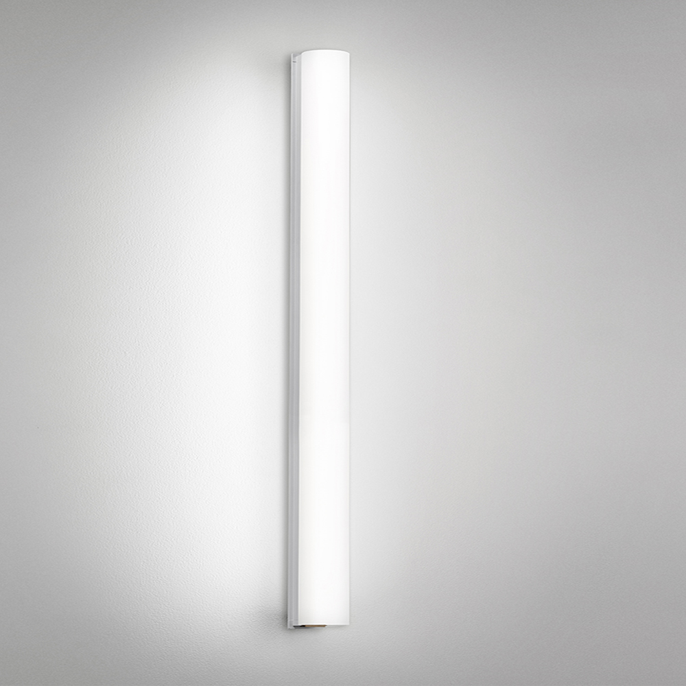A thin linear surface-mounted luminaire with a fully luminous round body