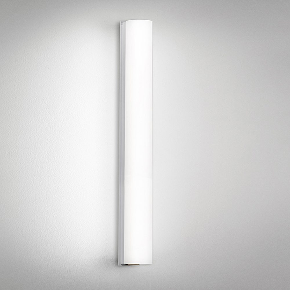 A thin linear surface-mounted luminaire with a fully luminous round body