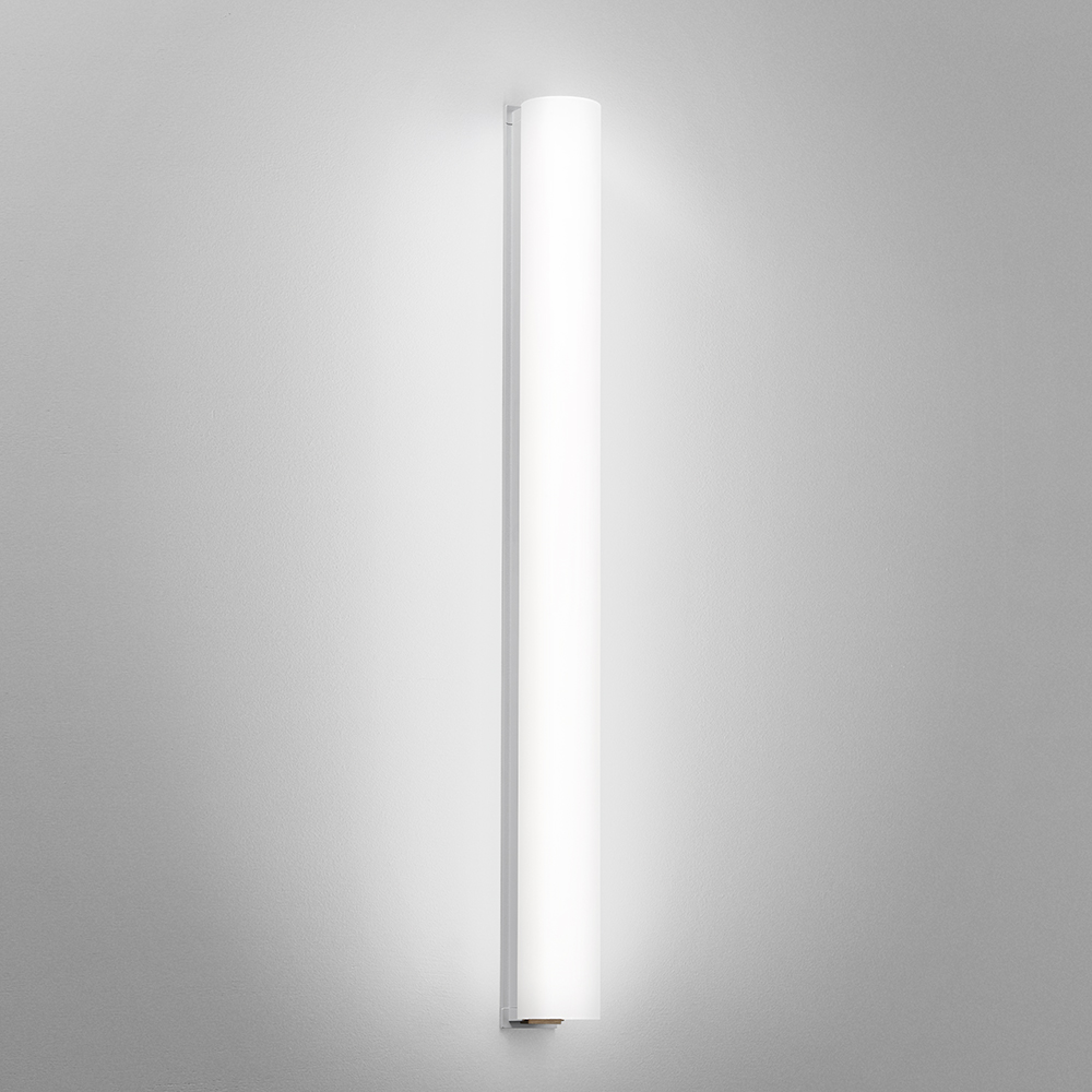 A thin linear surface-mounted luminaire with a fully luminous round body