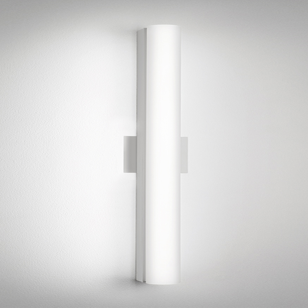 A thin linear surface-mounted luminaire with a fully luminous round body