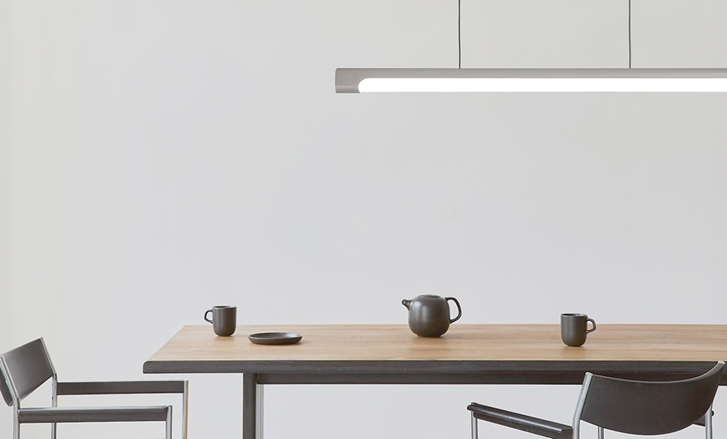 Slim and Sleek Nacelle Linear Pendant Light is great for a modern office space