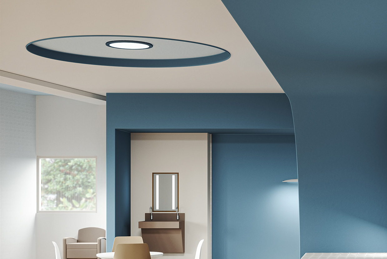 High abuse illuminated mirror and round ceiling design in behavioral health room