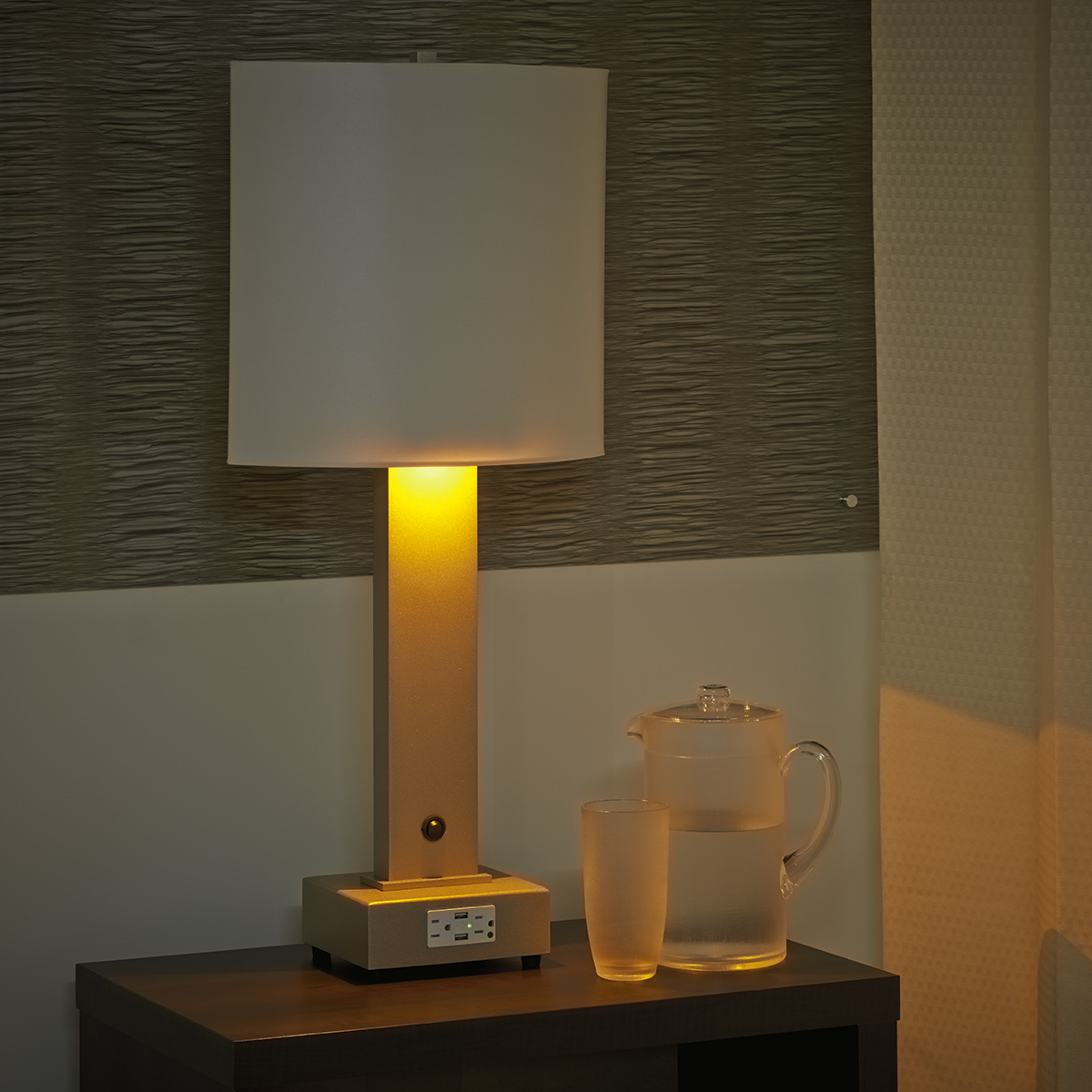 Table lamp next to hospital bed with night mode amber light