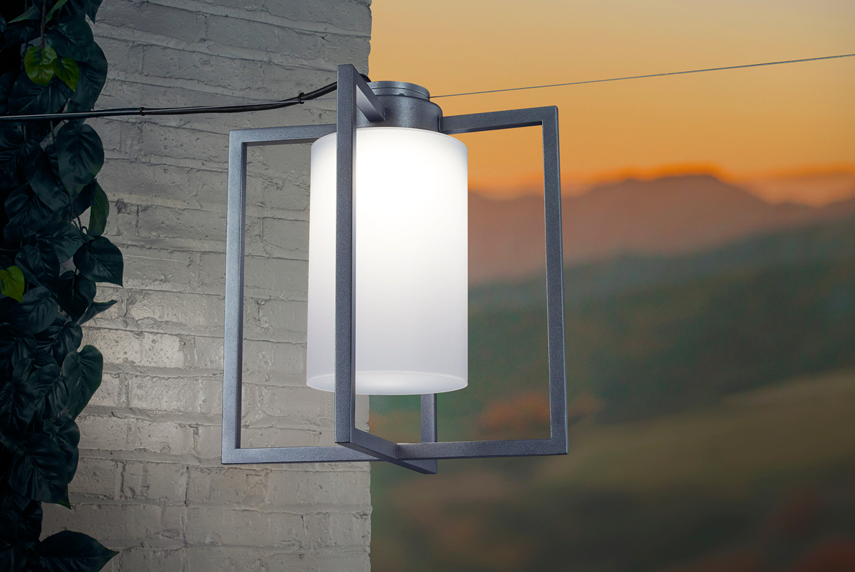 Outdoor lantern pendant light on patio with sunset