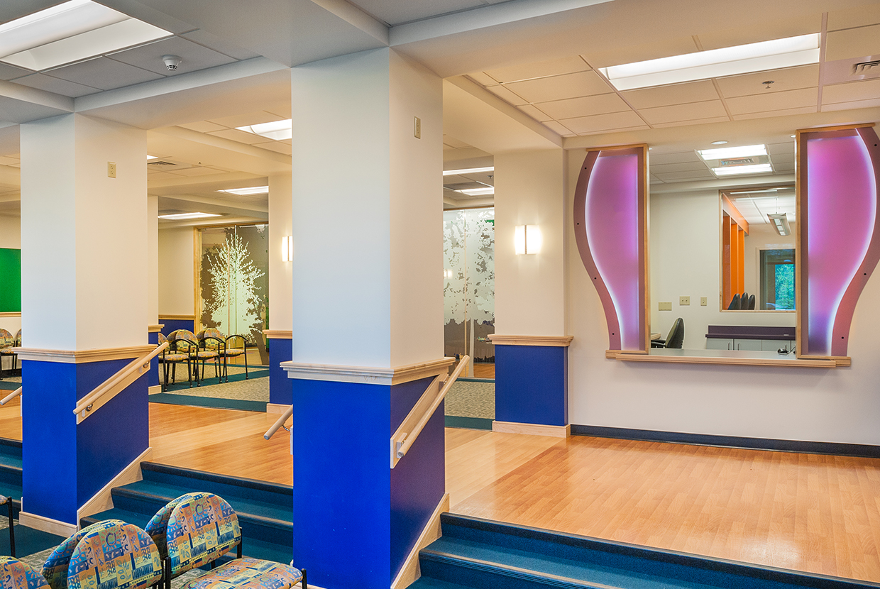 Basics wall sconces are minimal and charming for this hospital lighting design in a waiting area.