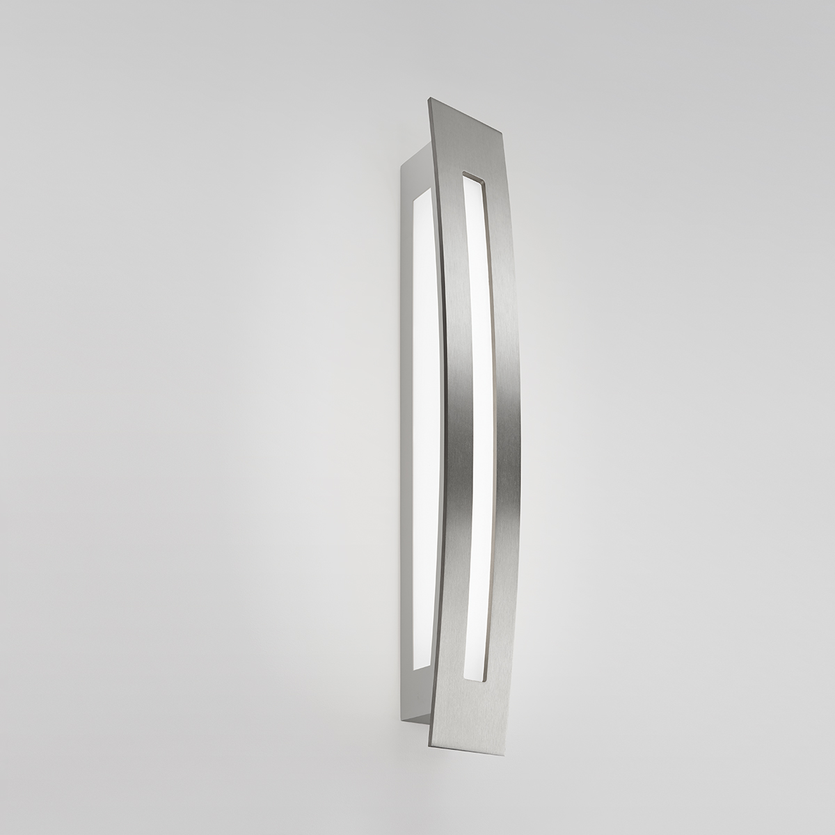 A long, multi-sided wall sconce with diffuse light cutouts 