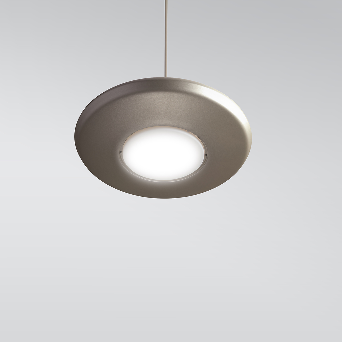 CP4450 Aries A round, disc-shaped pendant with a luminous downlight diffuser in the center