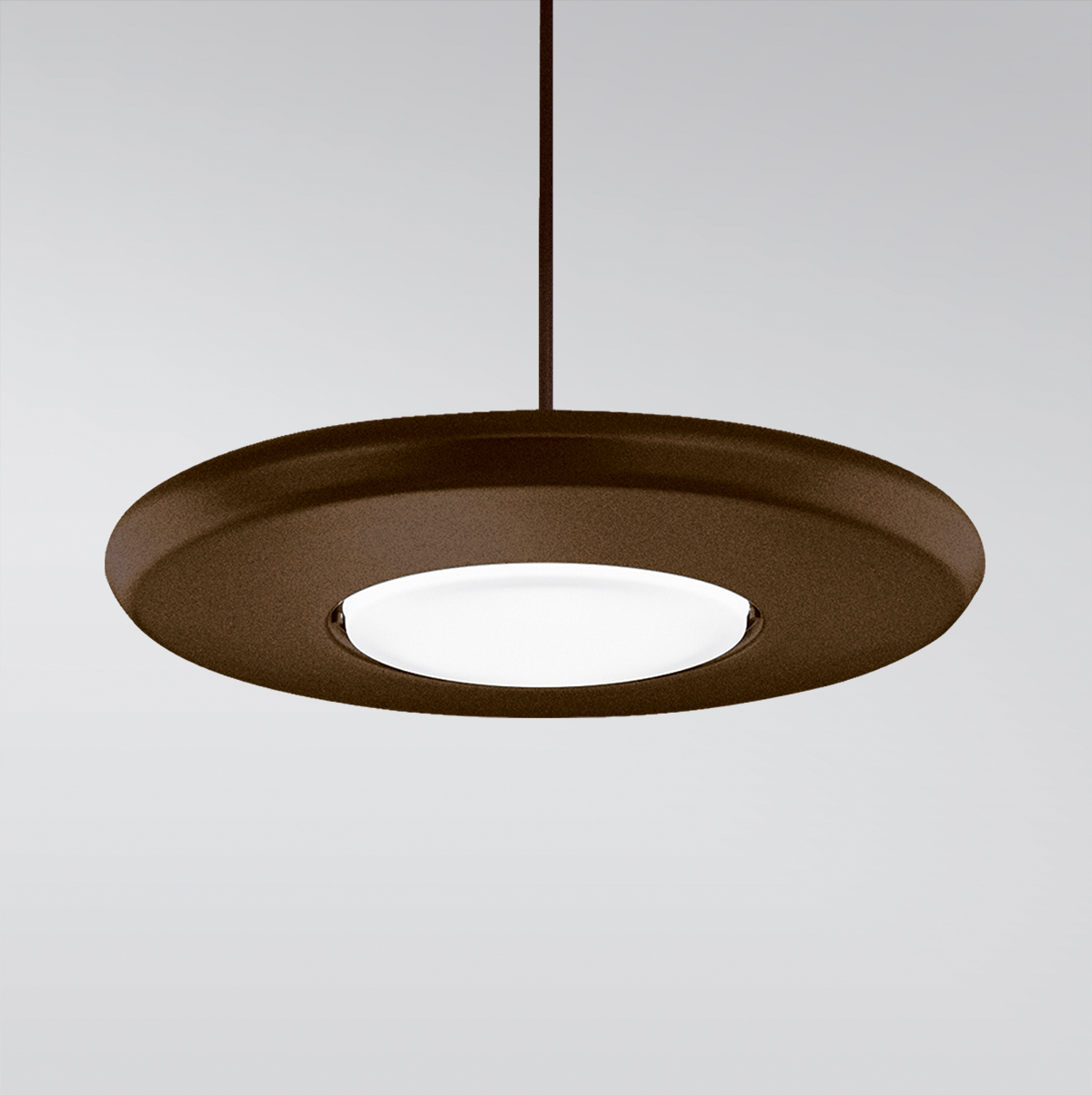CP4454 Aries A round, disc-shaped pendant with a luminous downlight diffuser in the center