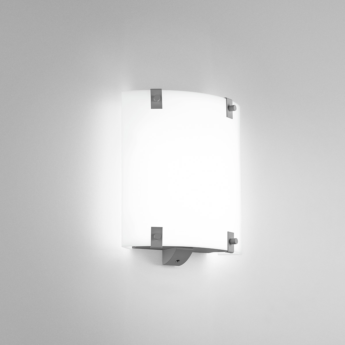 A small, square wall sconce with button accents