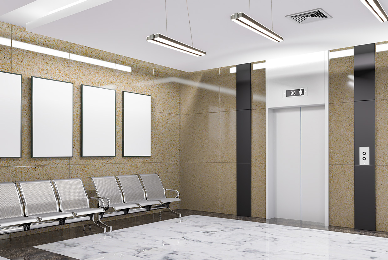 Sleight luminaire pendants in elevator lobby