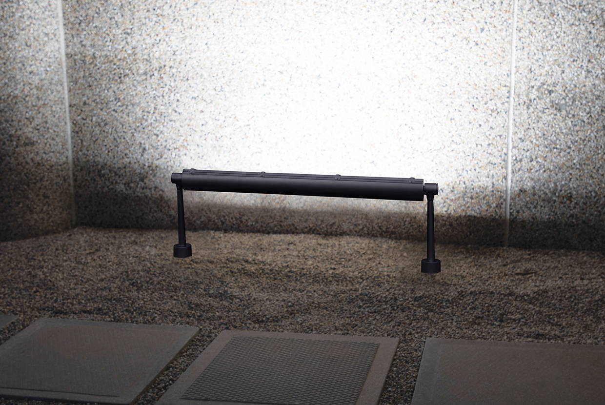 Advantus outdoor light fixtures illuminate an exterior wall along its upper edge, without revealing the light source. 