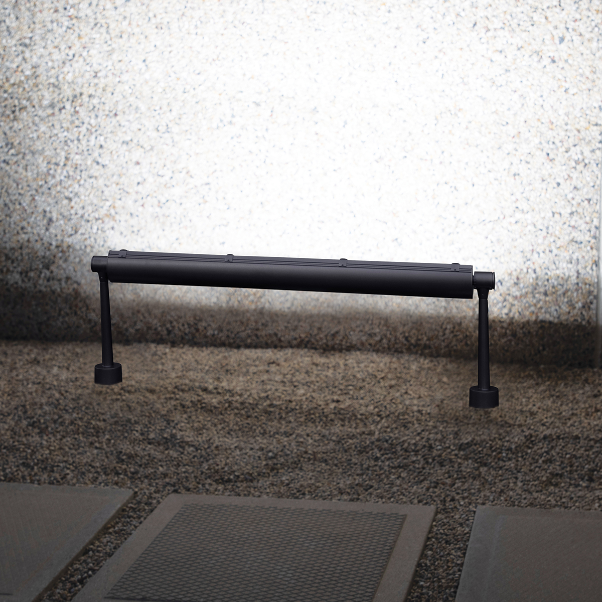 Advantus outdoor light fixtures illuminate an exterior wall along its upper edge, without revealing the light source. 