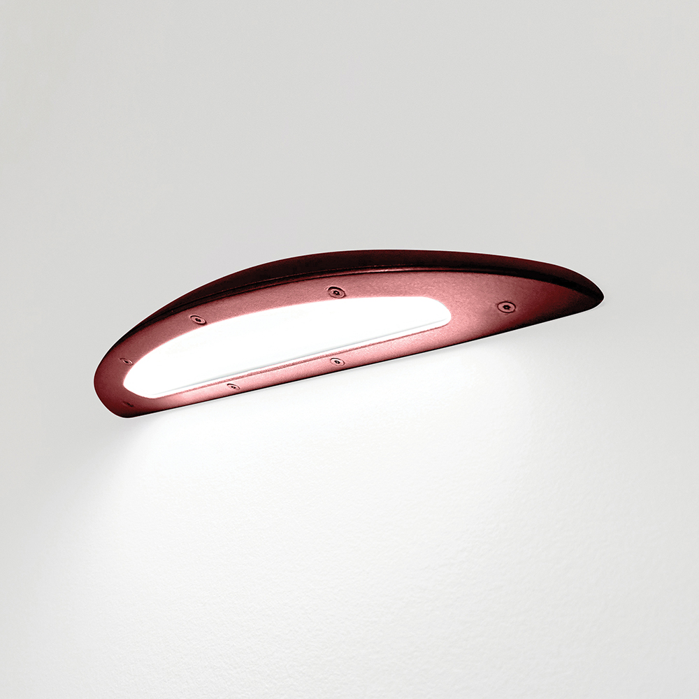 A down lighting wall sconce with a smooth, curved body