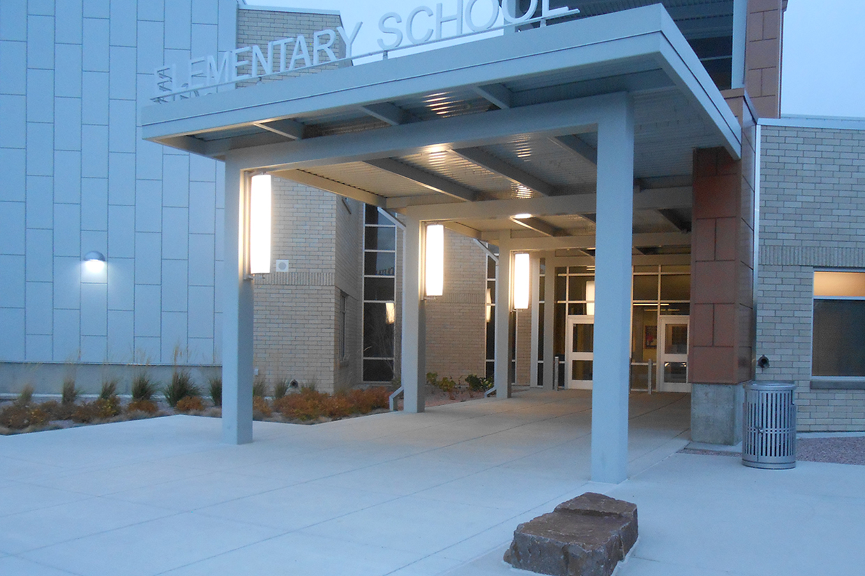 Air Foil sconces hung outside and elementary school