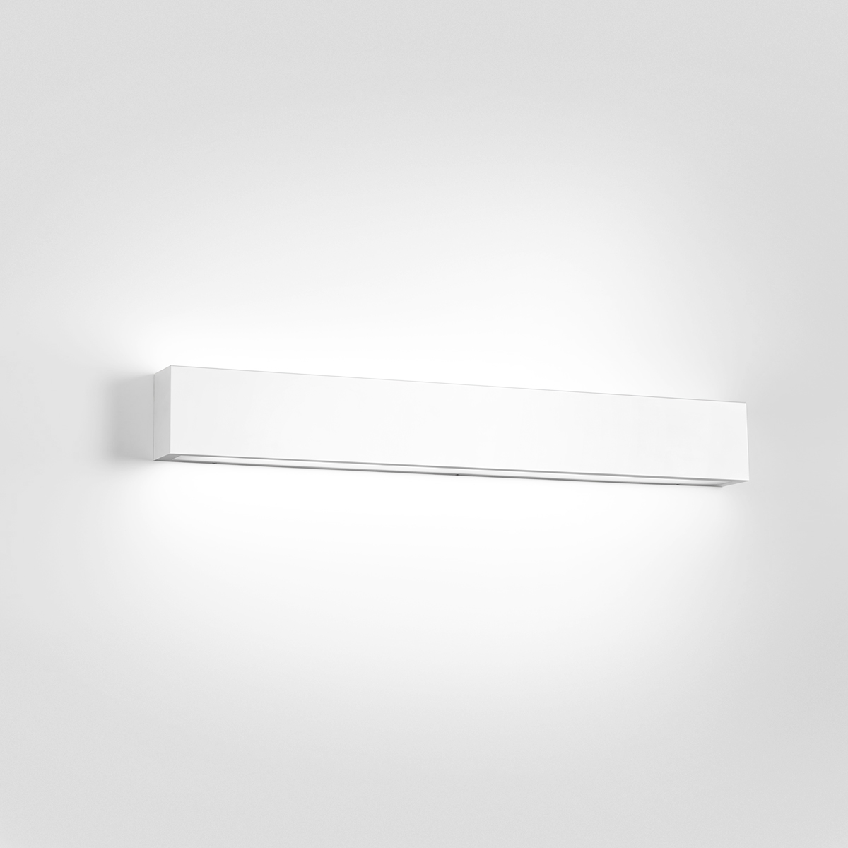 A box-like linear wall sonce with uplight and downlight