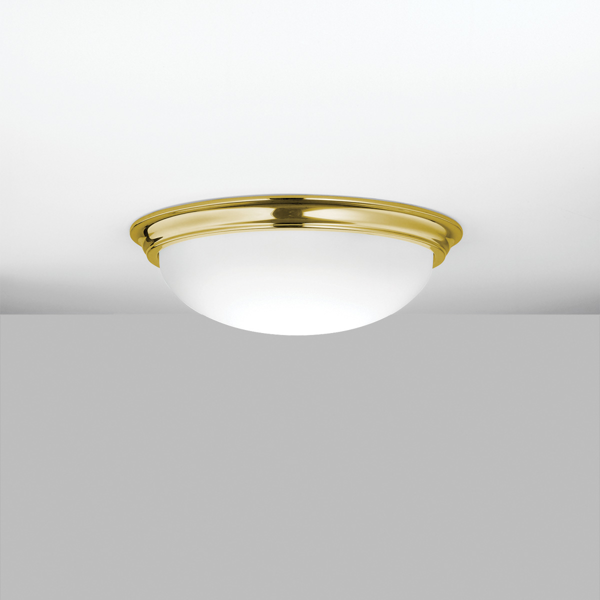 A ceiling-mounted bowl fixture with a shallow luminous bowl