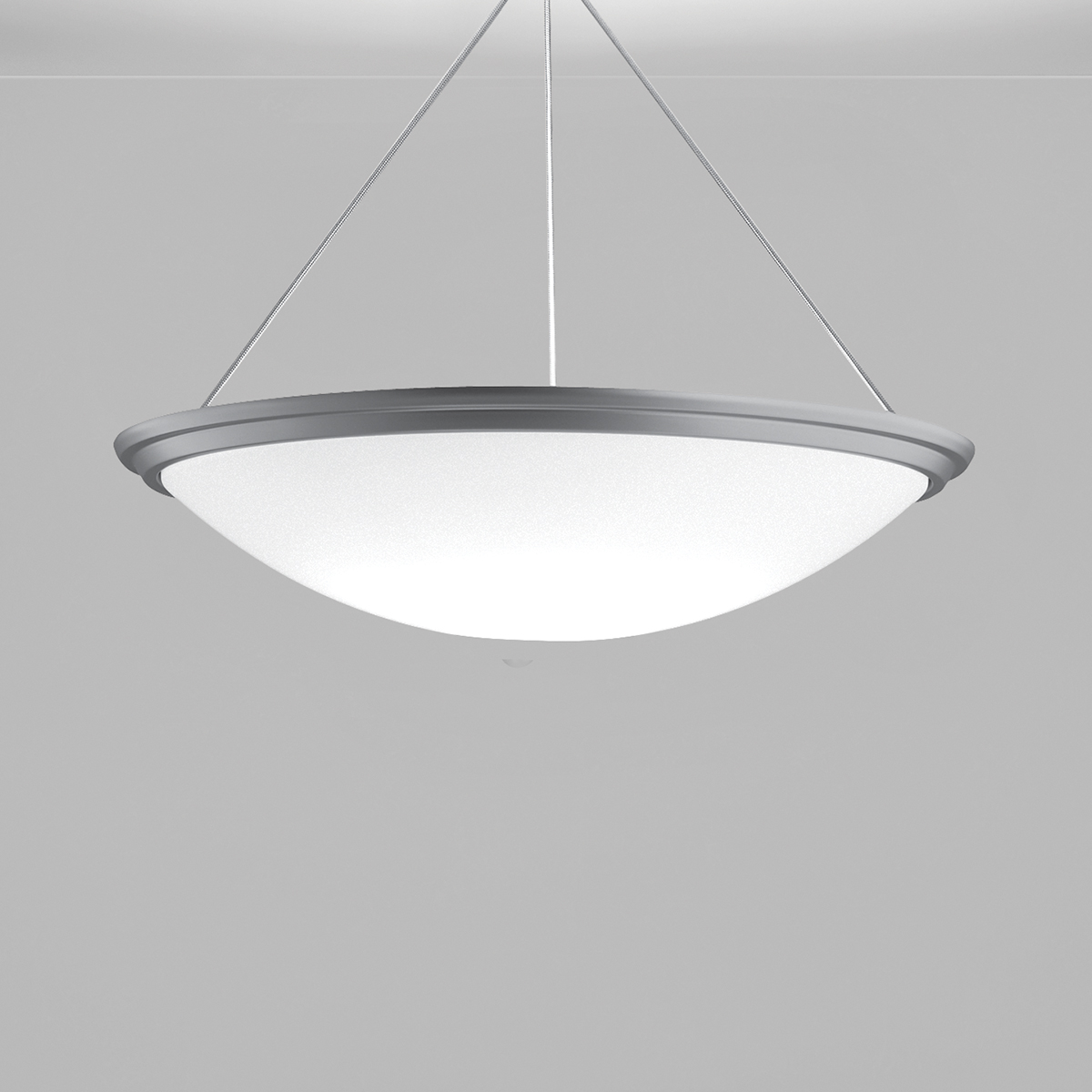 A large bowl pendant suspended with a cable