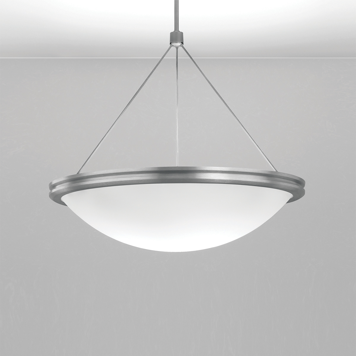 A large bowl pendant suspended with a cable