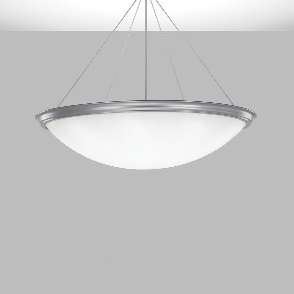 A large bowl pendant suspended with a cable