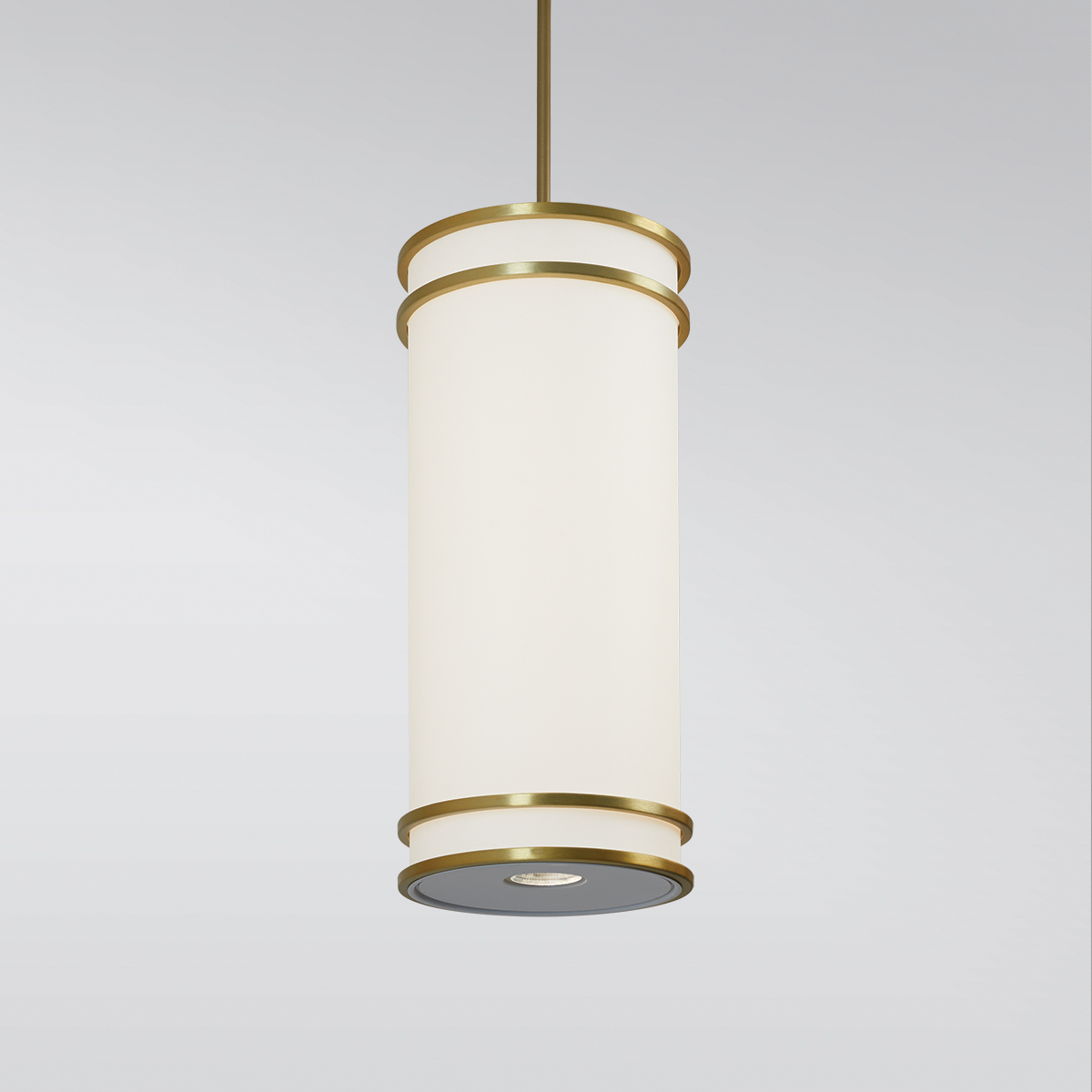 A large, luminous cylinder pendant with double bar accent