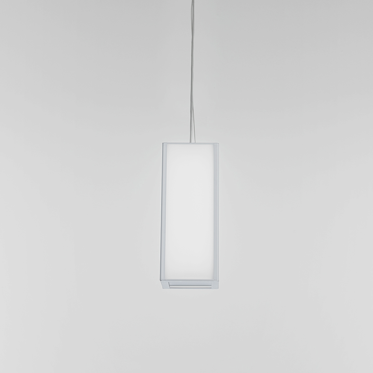 A large, rectangular pendant with a frame and luminous diffuser body 