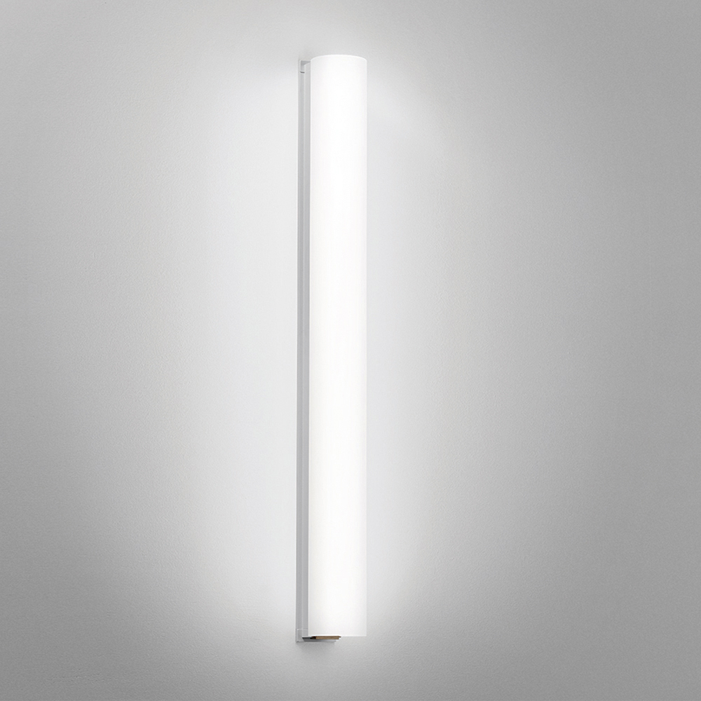 A thin linear surface-mounted luminaire with a fully luminous round body