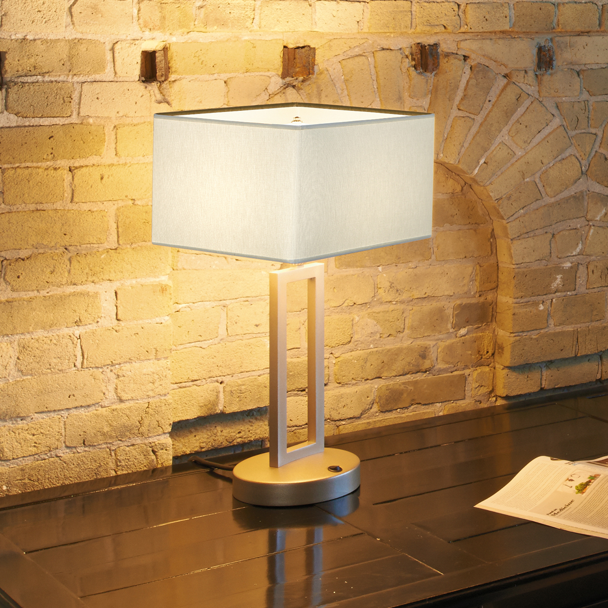 A table lamp with a fabric-looking shade