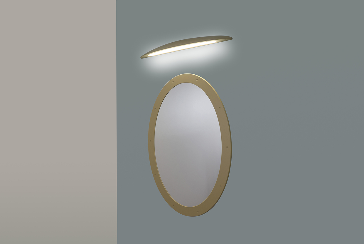 A down lighting wall sconce with a smooth, curved body