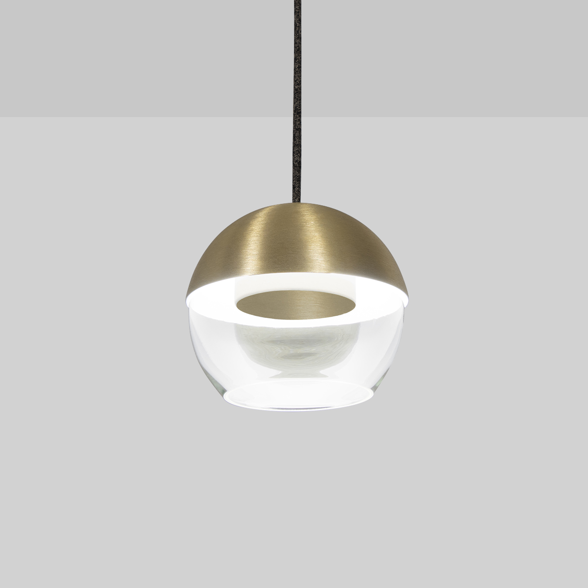 The 8” Muse pendant light globe utilizes a source disk that floats while reflecting indirect light.