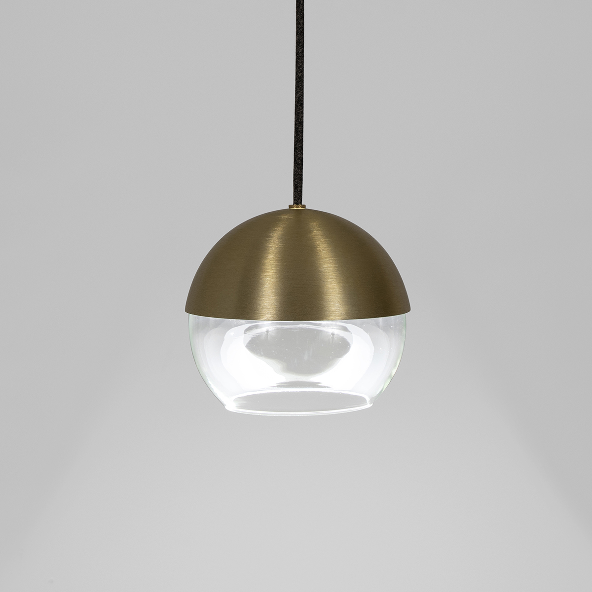 The 8” Muse pendant light globe utilizes a source disk that floats while reflecting indirect light.