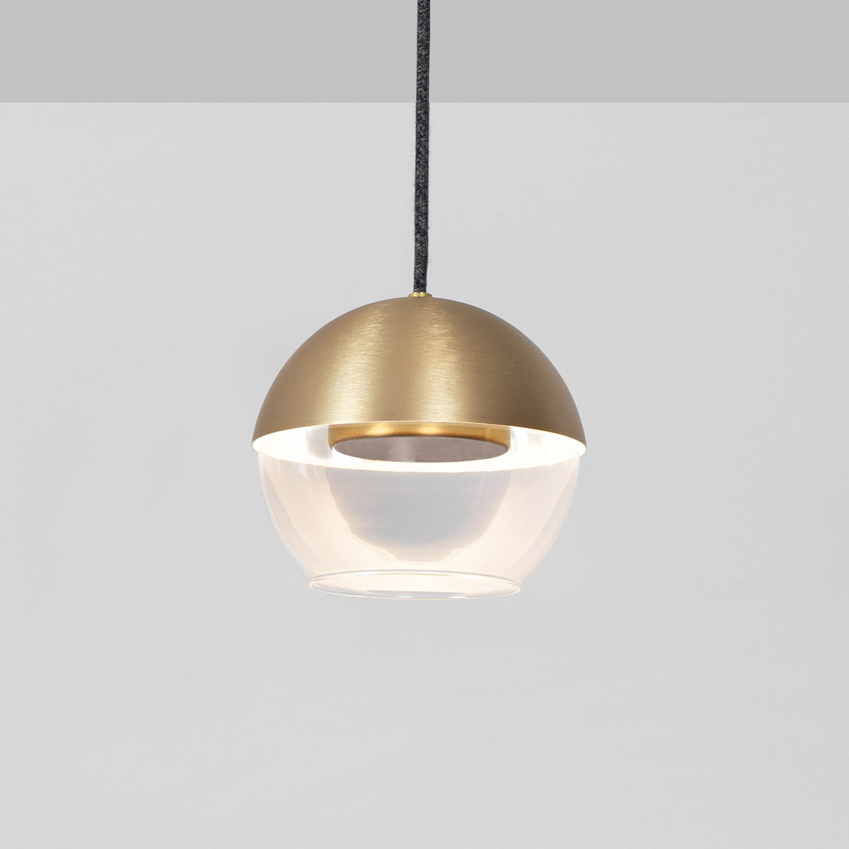 The 8” Muse pendant light globe utilizes a source disk that floats while reflecting indirect light.