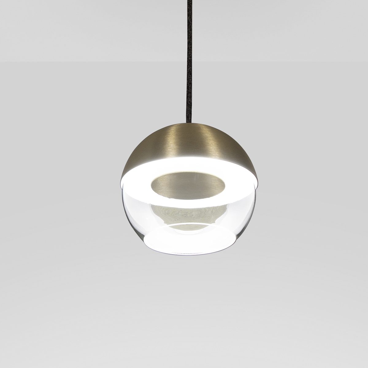 The 8” Muse pendant light globe utilizes a source disk that floats while reflecting indirect light.