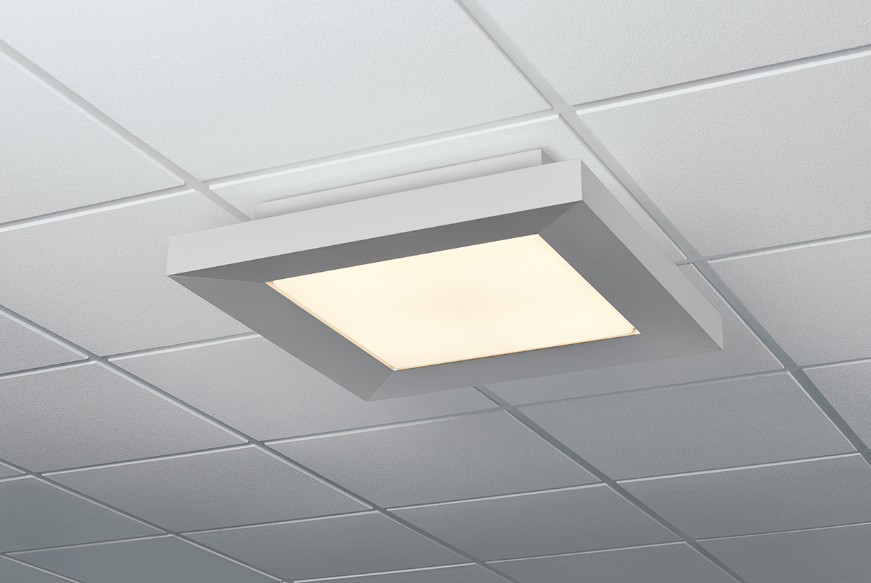 A square ceiling-mounted luminaire framing diffuse light