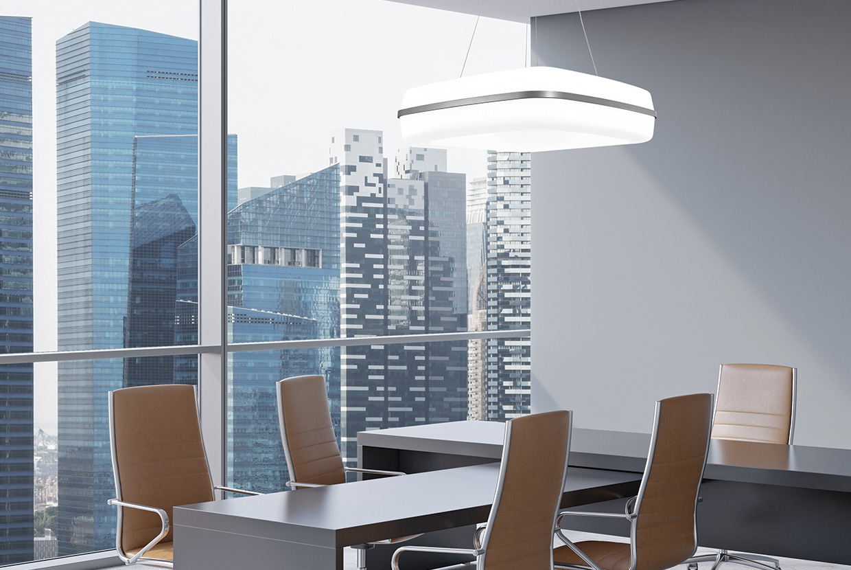 A fully luminous square pendant shown in a conference room