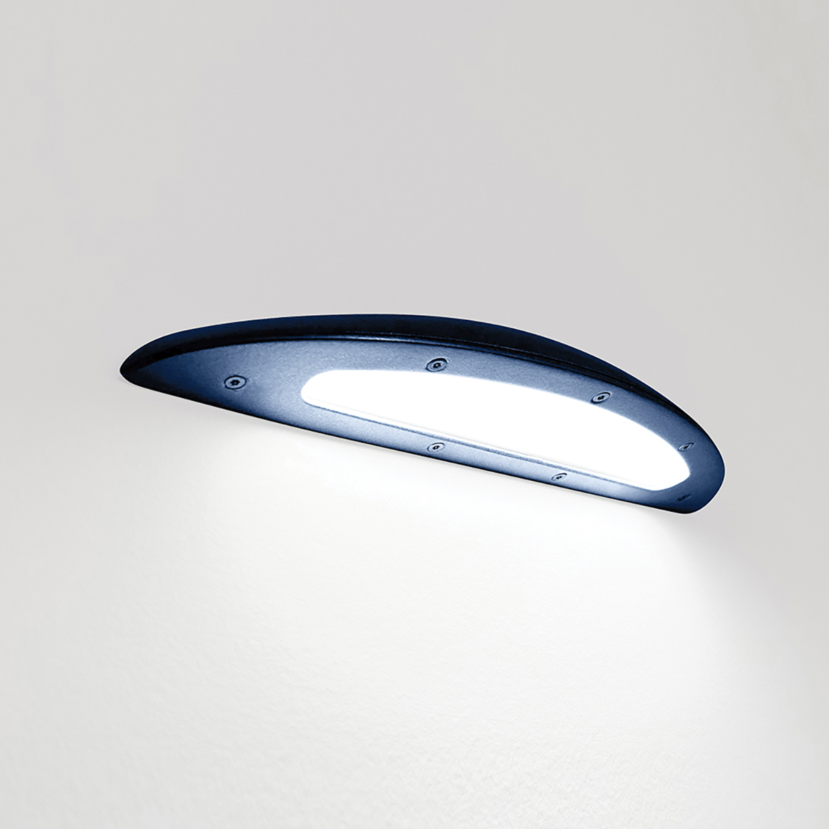 A down lighting wall sconce with a smooth, curved body