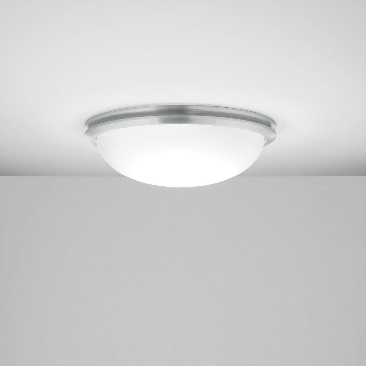 A ceiling-mounted bowl fixture with a shallow luminous bowl